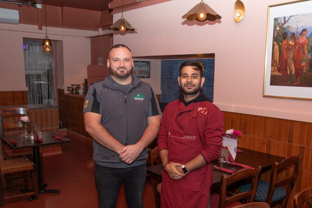 Kyle and Naman standing in the Saffron Ddraig restaurant
